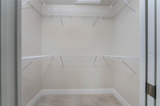 spacious closet featuring tile patterned floors