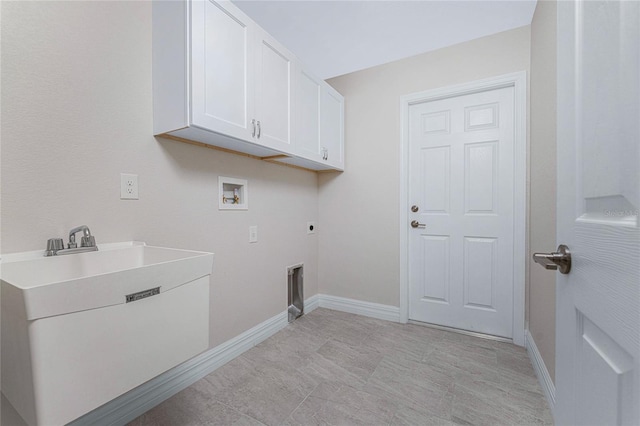 clothes washing area featuring hookup for an electric dryer, cabinets, sink, and washer hookup