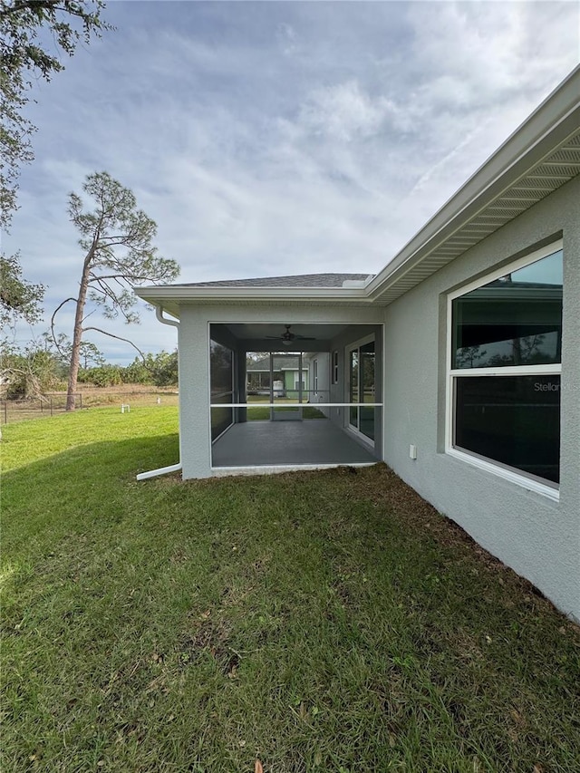 view of yard featuring a patio area and a sunroom