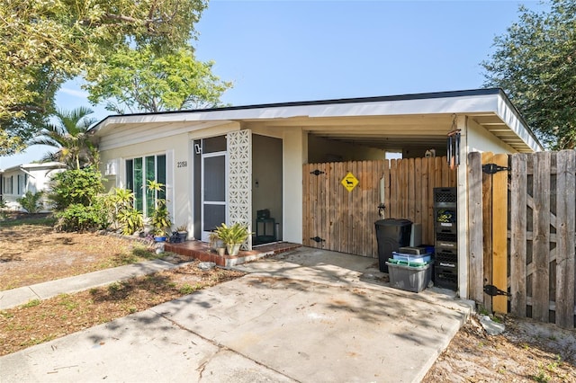 view of front of home with a carport