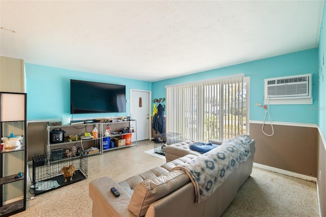 living room with a wall mounted air conditioner