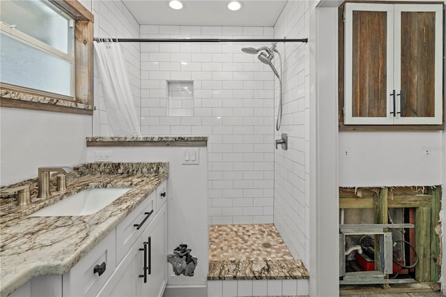 bathroom with a shower with curtain and vanity