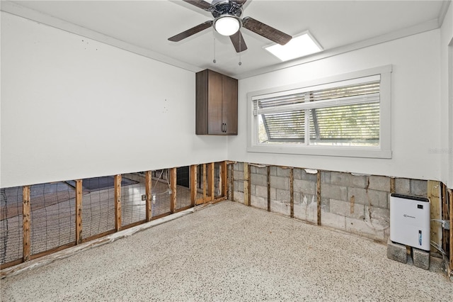 unfurnished room featuring ceiling fan and crown molding