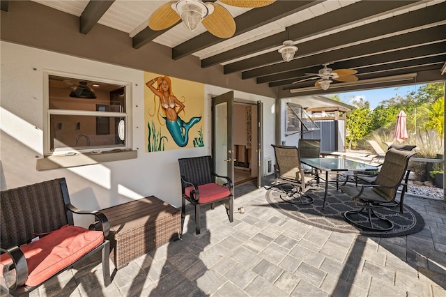 view of patio / terrace featuring ceiling fan