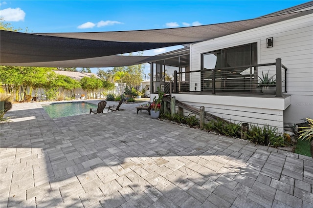 view of patio featuring a fenced in pool