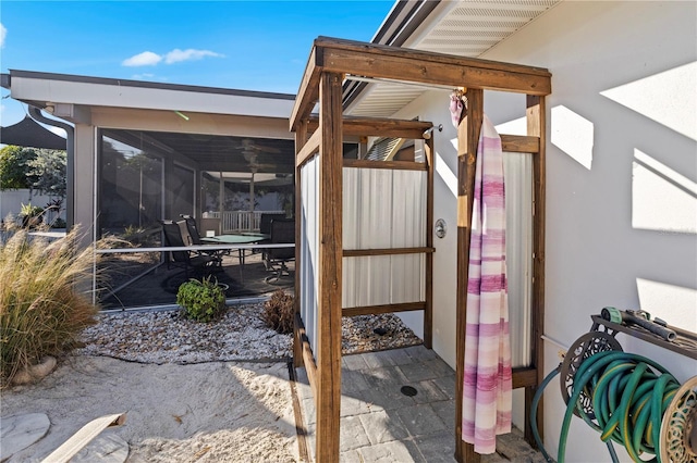 view of patio / terrace with a sunroom