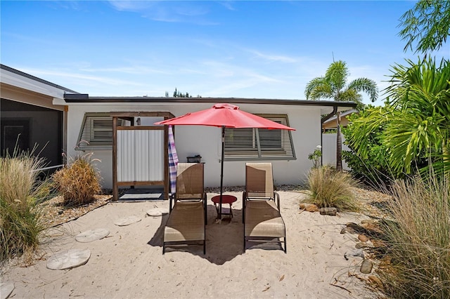 rear view of property featuring a patio area