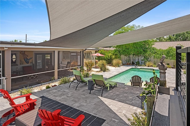 view of swimming pool featuring a patio area