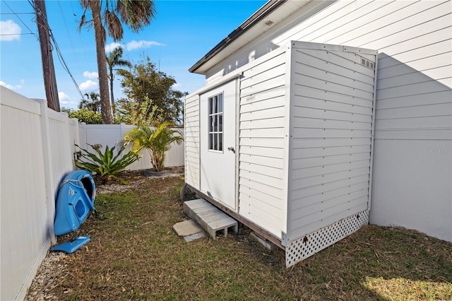 view of home's exterior with a storage shed