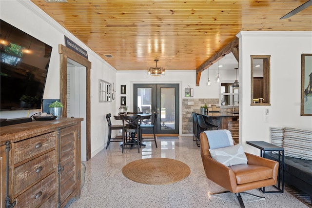 interior space with french doors, crown molding, sink, an inviting chandelier, and wooden ceiling