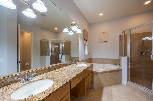 bathroom with separate shower and tub, tile patterned floors, and vanity