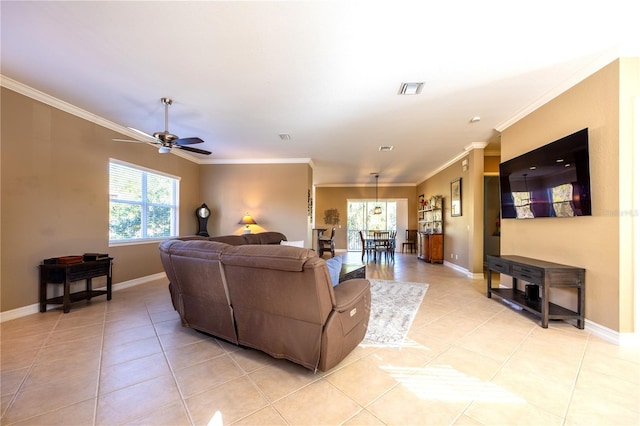 living room with ceiling fan, light tile patterned floors, and ornamental molding