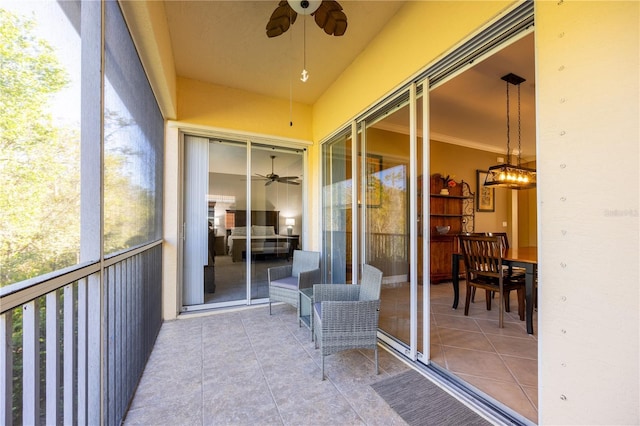 sunroom / solarium with ceiling fan