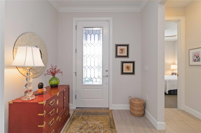 foyer featuring ornamental molding