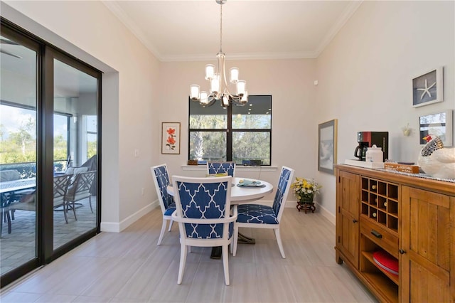 dining room with crown molding and a chandelier