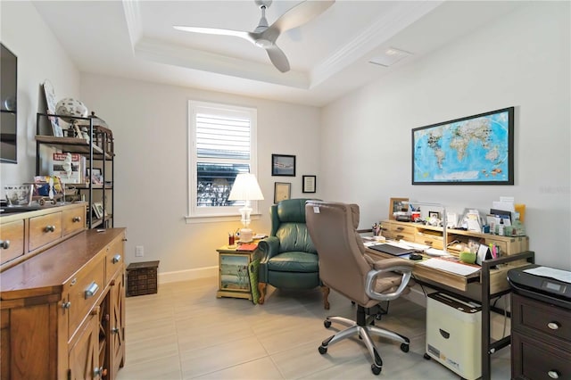 tiled office with a raised ceiling and ceiling fan