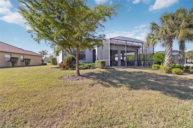 view of yard with a lanai