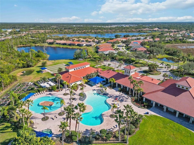 birds eye view of property featuring a water view