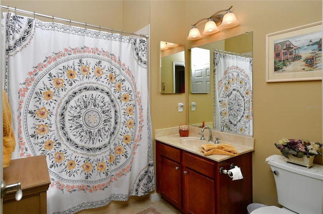 bathroom with vanity, toilet, and walk in shower