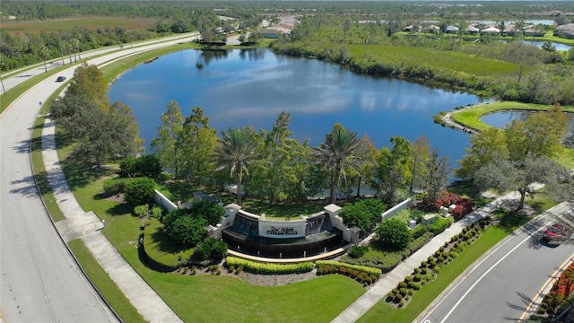 birds eye view of property with a water view