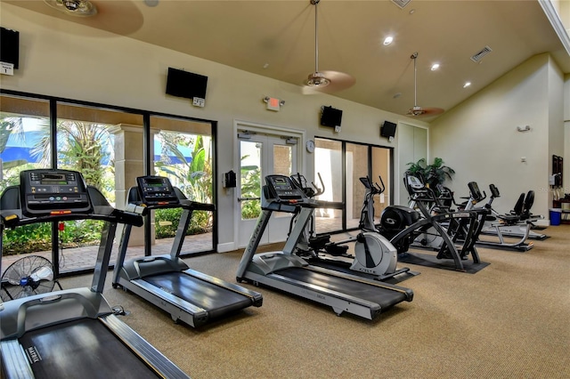 exercise room with carpet, ceiling fan, and high vaulted ceiling