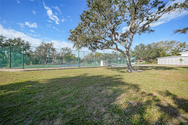 view of yard with tennis court