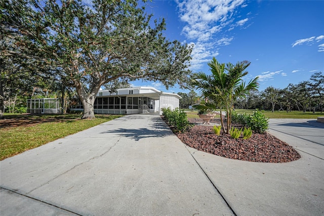 view of front of property featuring a sunroom