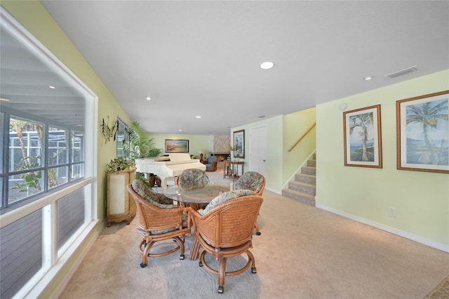 dining room with light carpet