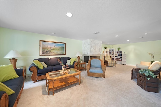 living room with light colored carpet and a fireplace