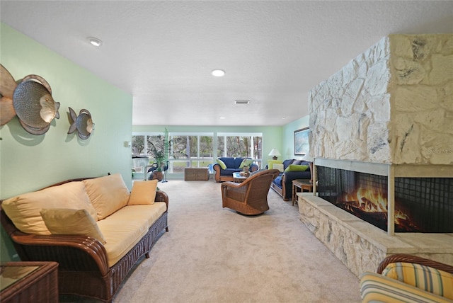 living room with a stone fireplace and light colored carpet