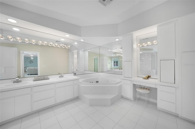 bathroom featuring tile patterned flooring, vanity, and a bathtub