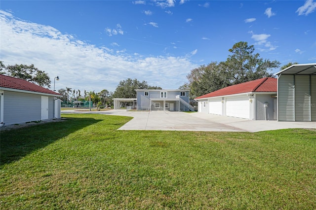 view of yard with a carport and a garage