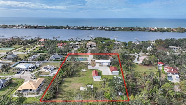 birds eye view of property featuring a water view