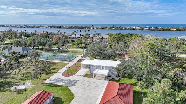 birds eye view of property with a water view