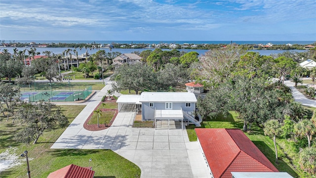 birds eye view of property with a water view