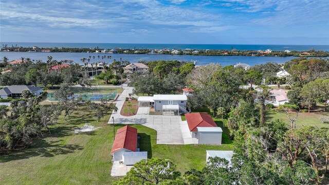 birds eye view of property with a water view