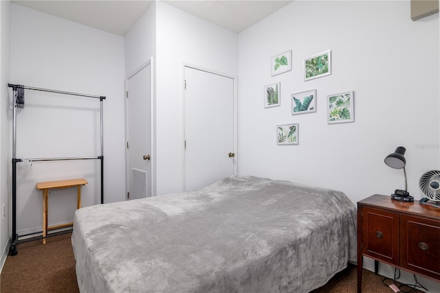 bedroom featuring dark carpet