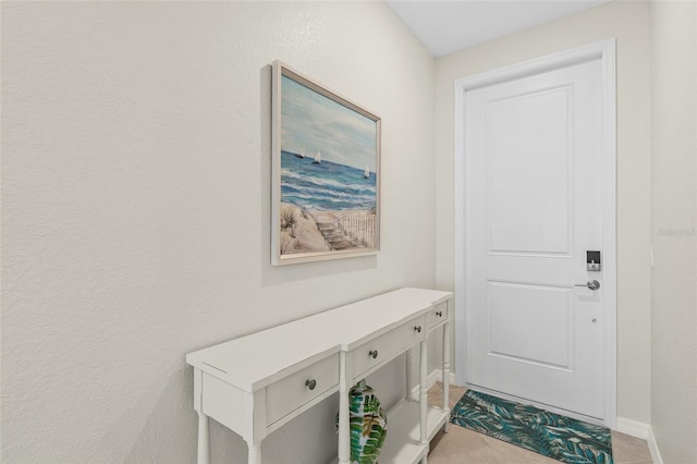 doorway featuring light tile patterned floors