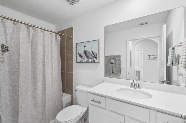 full bathroom with shower / bathtub combination with curtain, vanity, and toilet