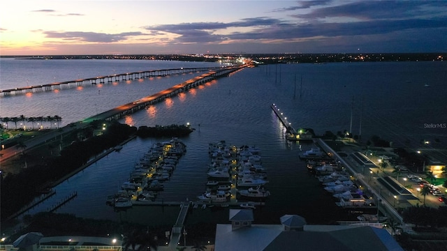 aerial view at dusk with a water view