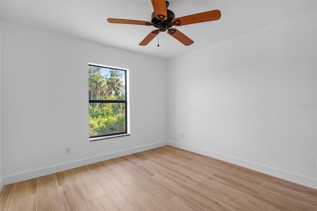 spare room featuring ceiling fan and light hardwood / wood-style flooring