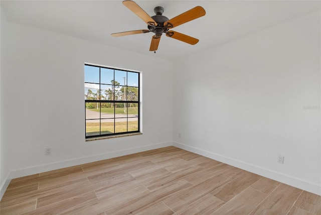 empty room featuring ceiling fan and light hardwood / wood-style floors