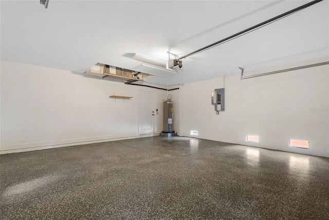 garage featuring electric panel, electric water heater, and a garage door opener