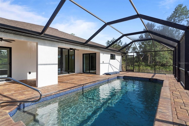 view of pool with a patio area, ceiling fan, and a lanai