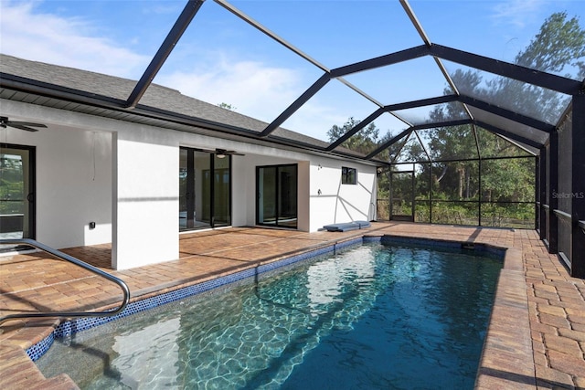 view of pool with a patio area, ceiling fan, and a lanai