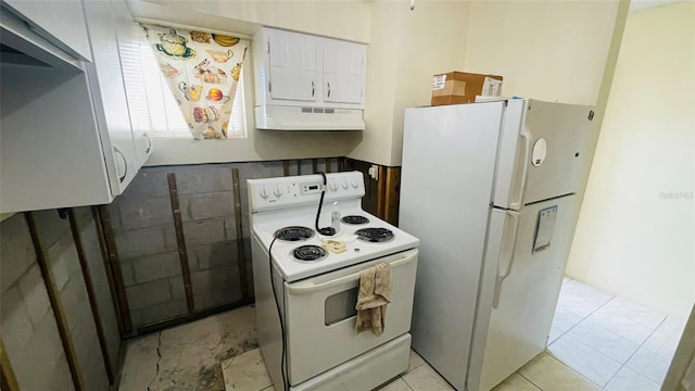 kitchen featuring white cabinets, light tile patterned floors, white appliances, and exhaust hood