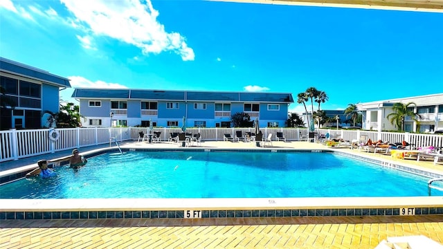 view of swimming pool with a patio area