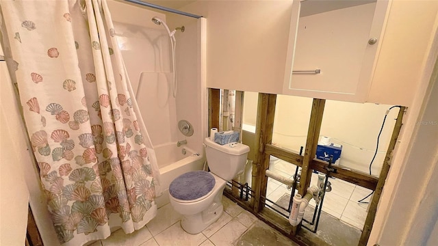 bathroom featuring shower / bath combo with shower curtain, tile patterned flooring, and toilet