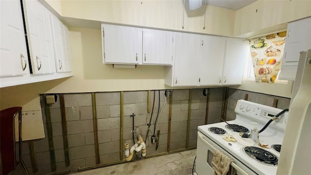 kitchen featuring white cabinets and white electric range