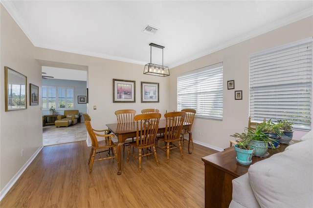 dining area featuring ceiling fan, a healthy amount of sunlight, and light hardwood / wood-style flooring